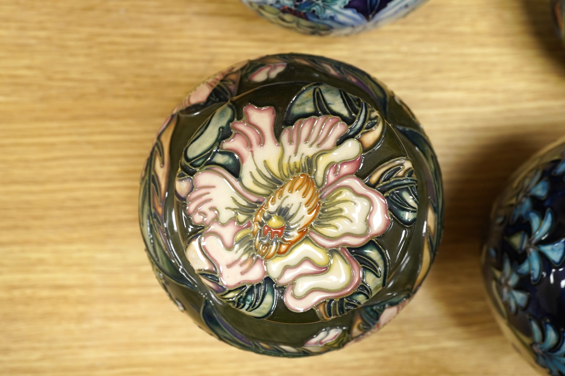 Four Moorcroft ginger jars and covers - ‘Midnight Blue’, ‘Inula’, ‘Sonans’ and ‘Gustav Augusta’ (4) 17cm high